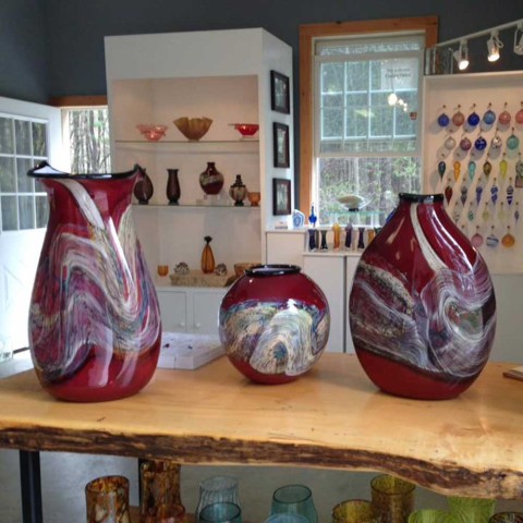 three hand-blown glass containers